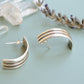 Minimalist semi hoops earrings crafted in silver, sleek handcrafted jewelry designer
