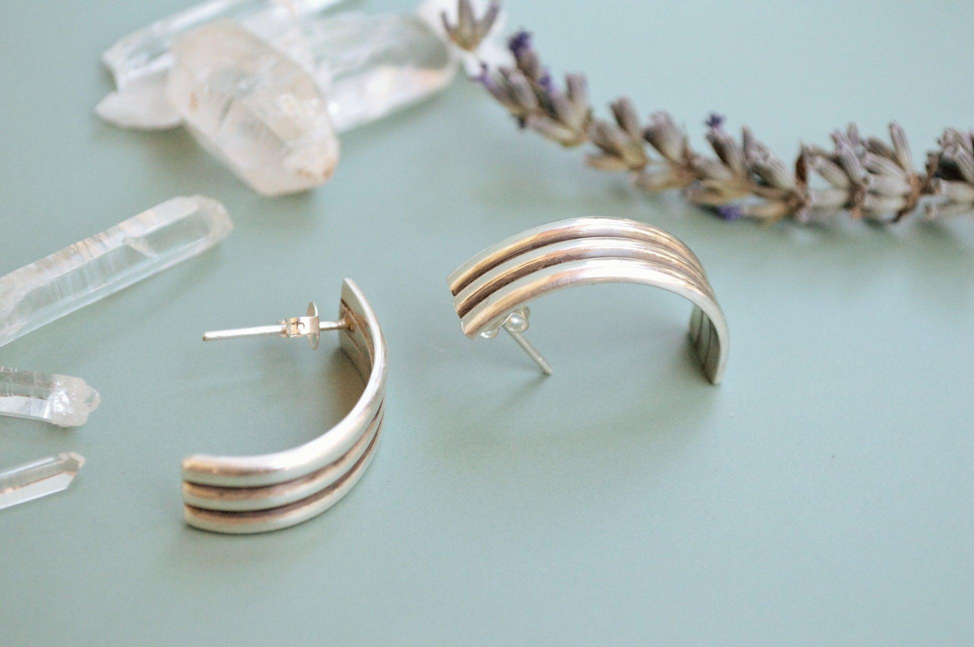 Minimalist semi hoops earrings crafted in silver, sleek handcrafted jewelry designer